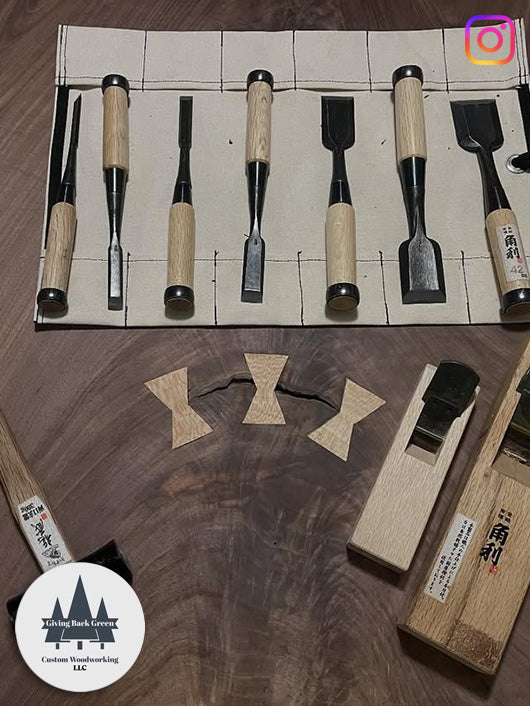 Kakuri chisels on a fabric mat, with wooden pieces being carved.